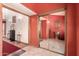 Elegant foyer with red accent wall, decorative mirror, and unique tile flooring at 8544 E San Lorenzo Dr, Scottsdale, AZ 85258