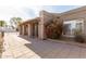 Inviting front porch with tiled walkway, lush flowers and convenient access to the home's entrance at 8544 E San Lorenzo Dr, Scottsdale, AZ 85258