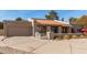 Charming single-story home with a red tile roof, attached garage and spacious driveway at 8544 E San Lorenzo Dr, Scottsdale, AZ 85258