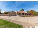 Single-story home with a red tile roof, attached garage, and desert landscaping in the front yard at 8544 E San Lorenzo Dr, Scottsdale, AZ 85258