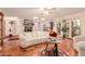 Bright living room featuring a fireplace, hardwood floors, and plenty of natural light at 8544 E San Lorenzo Dr, Scottsdale, AZ 85258