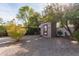 Backyard with gravel, trees, and a private outdoor shed at 8544 E San Lorenzo Dr, Scottsdale, AZ 85258