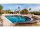 Backyard pool with lush desert landscaping and an outdoor patio area at 8544 E San Lorenzo Dr, Scottsdale, AZ 85258