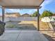 A spacious backyard features a covered patio, a concrete slab, and a brick-lined walkway at 8926 W Lockland Ct, Peoria, AZ 85382