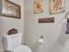 Charming half bathroom featuring playful Las Vegas themed decor and cozy ambiance at 8926 W Lockland Ct, Peoria, AZ 85382