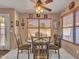 Casual dining area with a ceiling fan, a table, and natural light from the window at 8926 W Lockland Ct, Peoria, AZ 85382