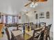 Elegant dining room with seating for eight, decorative accents, and views into the sitting area at 8926 W Lockland Ct, Peoria, AZ 85382