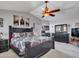 Comfortable main bedroom featuring a vaulted ceiling, ceiling fan and ample closet space at 8926 W Lockland Ct, Peoria, AZ 85382