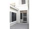 Inviting front entryway with a security door and a sunny, neutral-colored facade and trimmed windows at 10343 E Jacob Ave, Mesa, AZ 85209