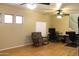 Versatile office space featuring hardwood floors, a ceiling fan, and bright natural light at 10343 E Jacob Ave, Mesa, AZ 85209