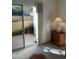 Bedroom has a sliding door and a nightstand at 10410 N Cave Creek Rd # 1103, Phoenix, AZ 85020