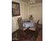 Cozy dining area featuring a round table with seating for four, set upon an ornate area rug at 10410 N Cave Creek Rd # 1103, Phoenix, AZ 85020