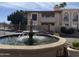 Exterior shot showcases a decorative fountain, with manicured landscaping in a well-maintained community at 10410 N Cave Creek Rd # 1103, Phoenix, AZ 85020