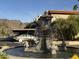 Decorative fountain with mountain views and lush desert landscaping in front of units at 10410 N Cave Creek Rd # 1103, Phoenix, AZ 85020