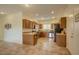 Functional kitchen with stainless steel appliances, wood cabinets, granite countertops, and a tile floor at 1066 E Sourwood Dr, Gilbert, AZ 85298