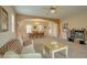 Bright, open-concept living room and dining area featuring an archway, recessed lighting, and neutral tones at 1066 E Sourwood Dr, Gilbert, AZ 85298