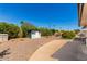 An expansive backyard with gravel landscaping and a small storage shed at 10846 W Sun City Blvd, Sun City, AZ 85351