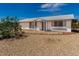 Single-story home with a xeriscaped front yard, covered entryway, and view of the blue sky at 10846 W Sun City Blvd, Sun City, AZ 85351