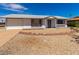 Charming single-story home featuring a xeriscaped front yard, attached garage, and covered entryway at 10846 W Sun City Blvd, Sun City, AZ 85351