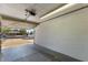 Well-lit garage with an open door showcasing the driveway and street at 10846 W Sun City Blvd, Sun City, AZ 85351