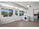 Functional laundry room with natural light and modern appliances offers a comfortable space at 10846 W Sun City Blvd, Sun City, AZ 85351