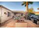 Back patio with brick flooring, patio seating and a grill at 1261 E Edgemont Ave, Phoenix, AZ 85006