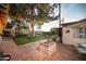 Backyard patio features a firepit, seating and brick design at 1261 E Edgemont Ave, Phoenix, AZ 85006