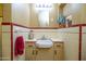 Charming bathroom featuring a unique sink and tiled backsplash at 1261 E Edgemont Ave, Phoenix, AZ 85006