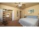 Cozy bedroom features a ceiling fan, open closet, and comfortable furnishings at 1261 E Edgemont Ave, Phoenix, AZ 85006