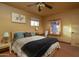 Well-lit bedroom with a ceiling fan, writing desk, and ample space at 1261 E Edgemont Ave, Phoenix, AZ 85006