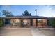 Inviting front porch with brick accents and cozy seating area, perfect for relaxing at 1261 E Edgemont Ave, Phoenix, AZ 85006