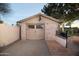 Detached garage with stone accents and a neutral-colored door, complementing the property's style at 1261 E Edgemont Ave, Phoenix, AZ 85006