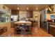 Bright kitchen with stainless steel appliances, terracotta tile floor, and island at 1261 E Edgemont Ave, Phoenix, AZ 85006