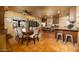 Bright kitchen with stainless steel appliances, terracotta tile floor, island, and dining area at 1261 E Edgemont Ave, Phoenix, AZ 85006