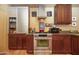 Kitchen with stainless steel oven, terracotta tile floor, granite countertops, and stainless steel appliances at 1261 E Edgemont Ave, Phoenix, AZ 85006