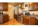 Kitchen with stainless steel oven, terracotta tile floor, granite countertops, and stainless steel appliances at 1261 E Edgemont Ave, Phoenix, AZ 85006