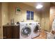 Laundry room with sink, washer, and dryer at 1261 E Edgemont Ave, Phoenix, AZ 85006