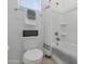 Bathroom with a tiled shower-tub, white walls, and neutral towel set on the towel rack at 14254 W Cottontail Ln, Surprise, AZ 85387