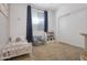 bedroom featuring a toddler bed, a blue chair, and ample space at 14254 W Cottontail Ln, Surprise, AZ 85387