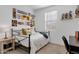 Fun bedroom with a metal bed frame, vintage sign decor, and a playful atmosphere at 14254 W Cottontail Ln, Surprise, AZ 85387