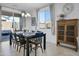 Bright dining area with a view to the backyard and a stylish wooden cabinet at 14254 W Cottontail Ln, Surprise, AZ 85387