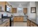 Bright kitchen featuring granite countertops, stainless steel appliances, and ample cabinet space at 14254 W Cottontail Ln, Surprise, AZ 85387