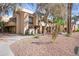 Inviting condo exterior featuring manicured landscaping and pathways to each unit at 1432 W Emerald Ave # 742, Mesa, AZ 85202