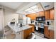 Well-lit kitchen with stainless steel appliances, granite countertops, and a breakfast bar at 1432 W Emerald Ave # 742, Mesa, AZ 85202