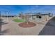 Low maintenance backyard with artificial turf, light colored rock, and a decorative pergola perfect for entertaining at 148 N Glenview --, Mesa, AZ 85213