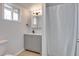 Bright bathroom featuring a gray vanity, tile flooring, and a shower with a white curtain at 148 N Glenview --, Mesa, AZ 85213