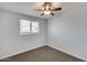 Bedroom featuring neutral carpet and a ceiling fan at 148 N Glenview --, Mesa, AZ 85213