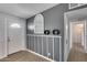 Inviting entryway featuring stylish gray walls, modern accents, and a well-lit hallway at 148 N Glenview --, Mesa, AZ 85213