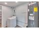 The laundry room features a washer and dryer and is located next to a water heater at 148 N Glenview --, Mesa, AZ 85213