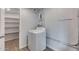 This well lit laundry room features a washer and dryer with an entrance to a pantry at 148 N Glenview --, Mesa, AZ 85213